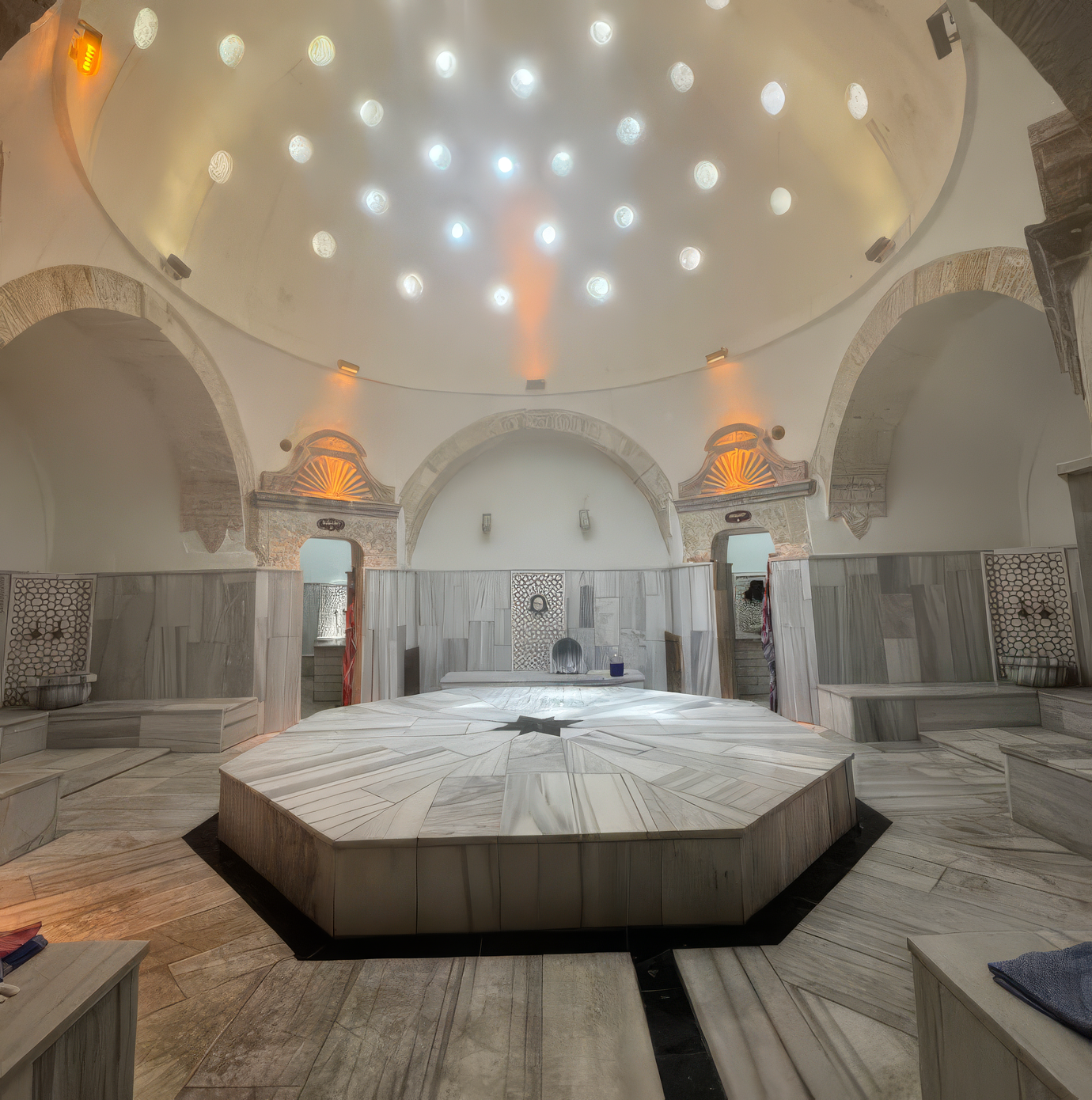 Wide view of the domed hot room and octagonal göbek taşı inside Ürgüp Hamam.