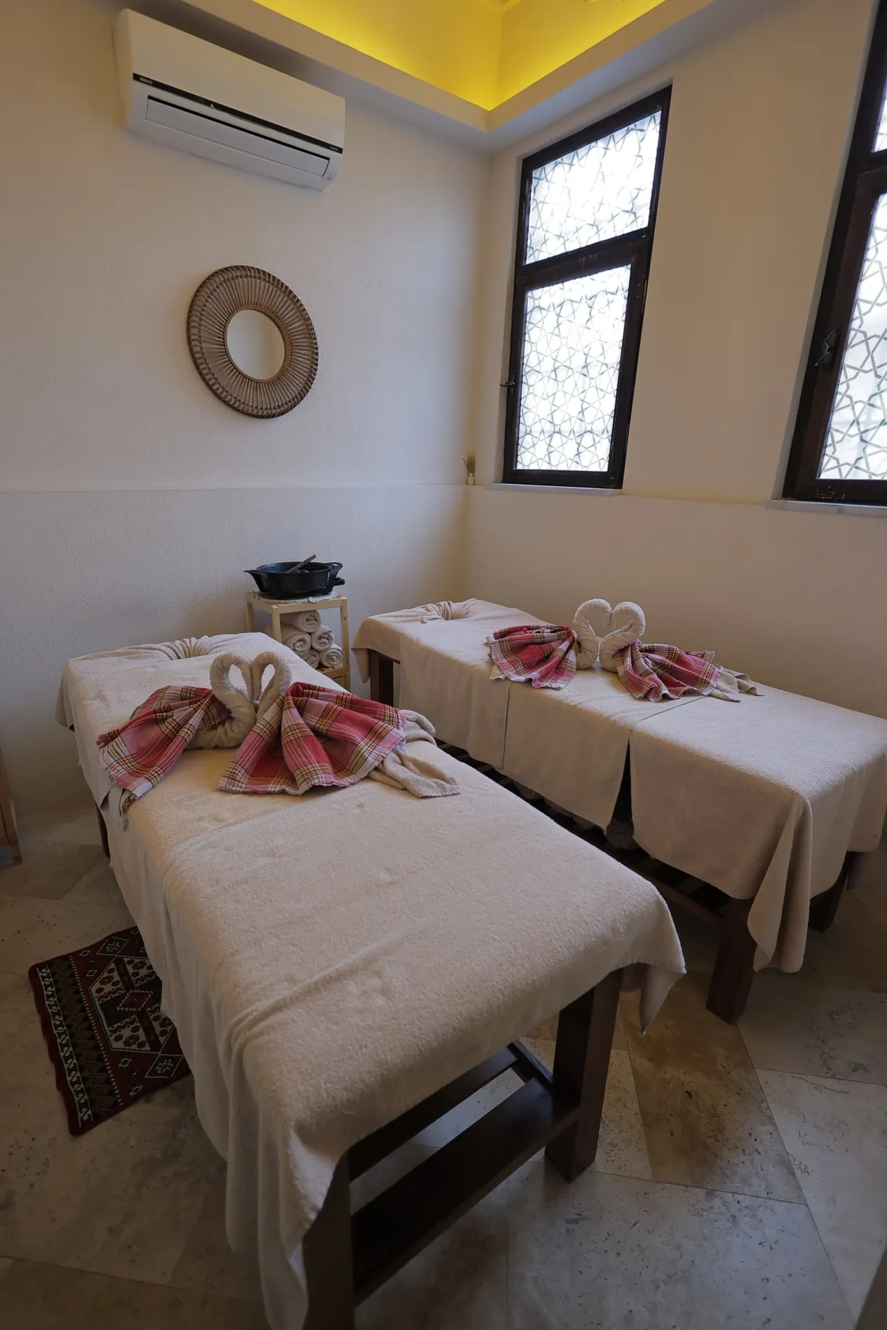 Two massage tables side by side in the couples massage room at Ürgüp Hamam