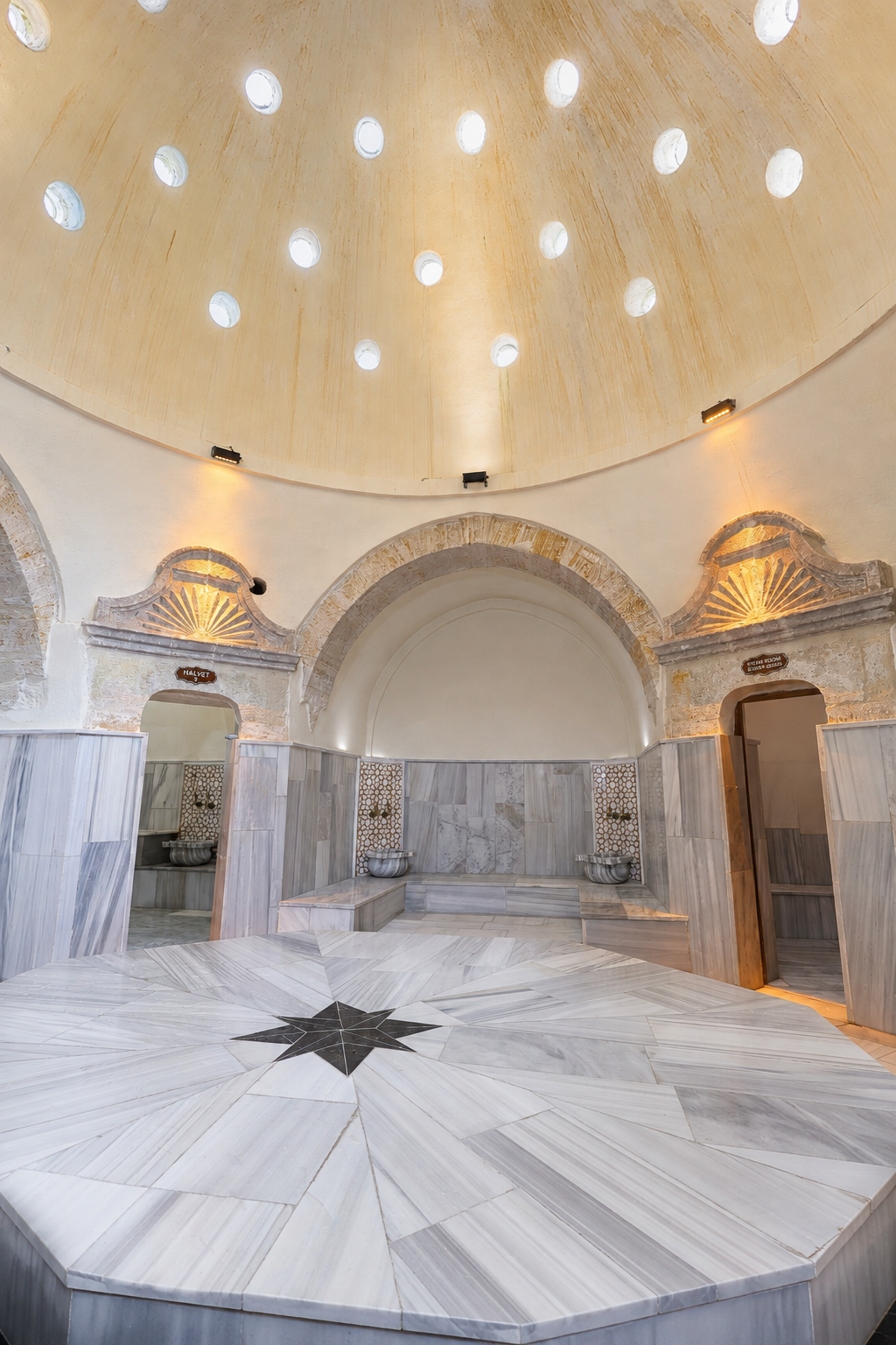 Daylight entering through the domed hot room above the marble göbek taşı at Ürgüp Hamam.